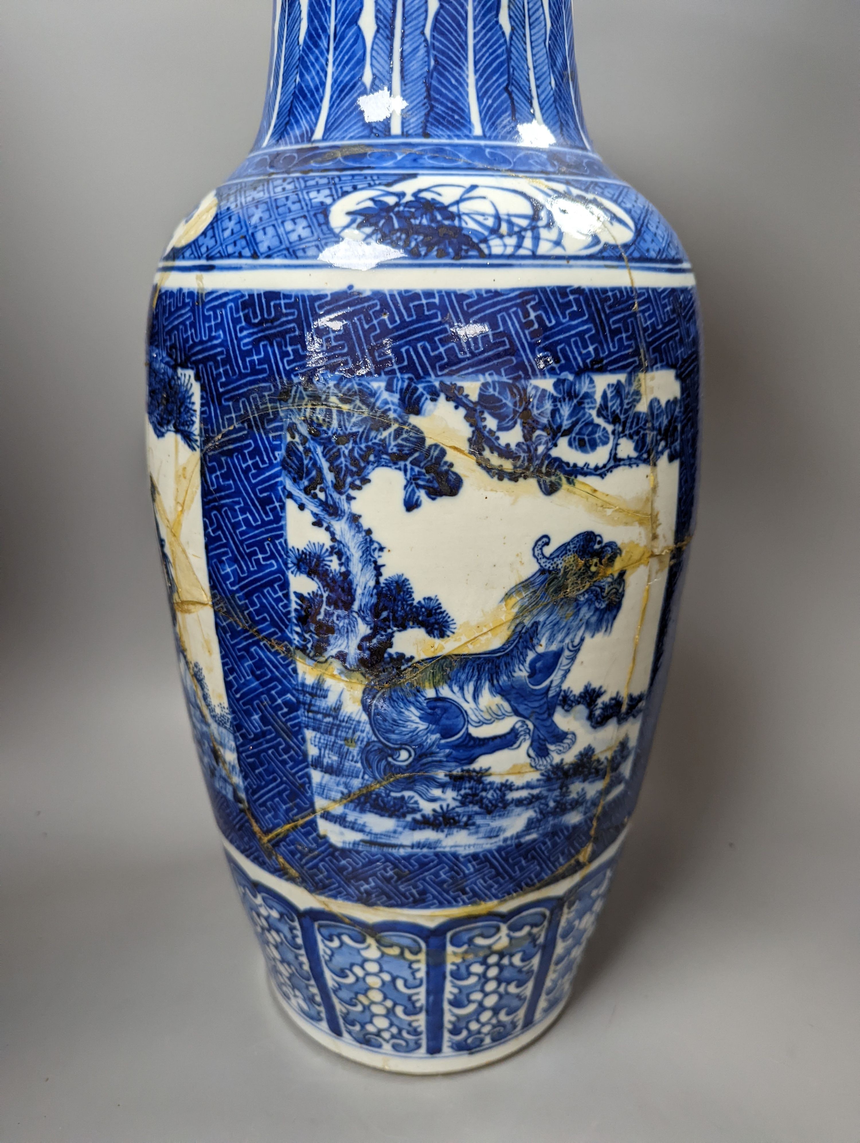 A pair of large early 20th century Chinese Blue and white ‘mythical beast’ vases, 60 cms high.